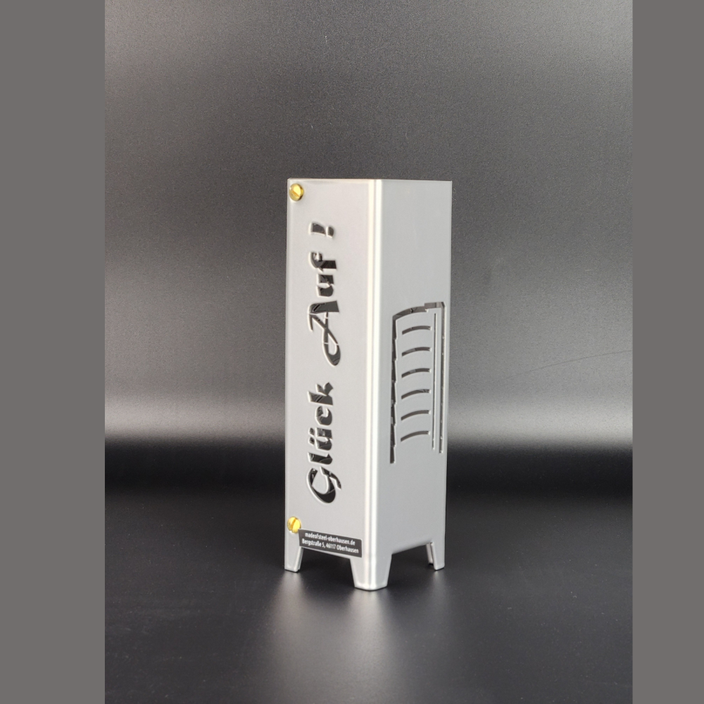 Teelicht Oberhausen aus Metall. Schriftzug Glück auf und Symbol Gasometer in brillant silber pulverbeschichtet