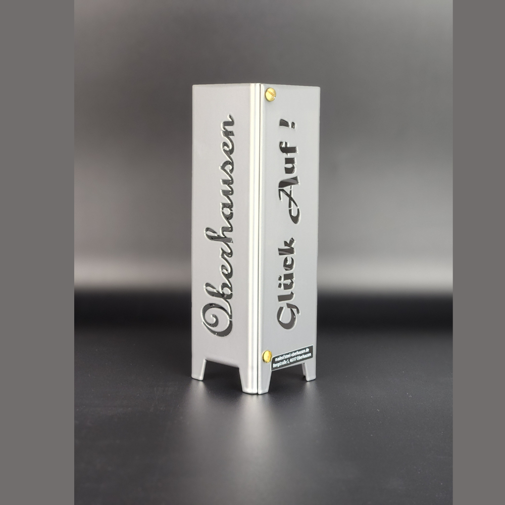 Teelicht Oberhausen aus Metall. Schriftzug Oberhausen und Schriftzug Glück auf in brillant silber pulverbeschichtet