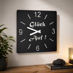 Glück auf Wanduhr aus Edelstahl schwarz matt pulverbeschichtet. Wanddekoration