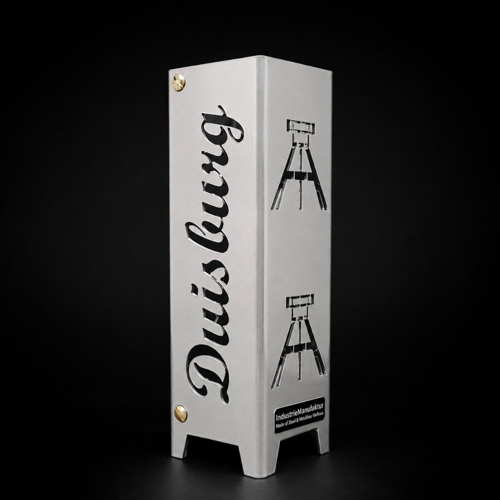 Teelicht Duisburg aus Metall mit ausgelaserten Schriftzügen „Duisburg“ und „Glück auf“ sowie Bergbau-Motiven Förderturm und Schlägel und Eisen. Erhältlich in Brillant Silber oder Schwarz matt Feinstruktur pulverbeschichtet.